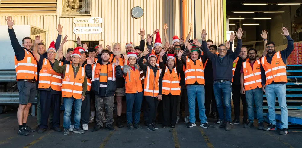 D&G Fresh Fruit staff celebrating Christmas 2024 on the Pooraka market floor